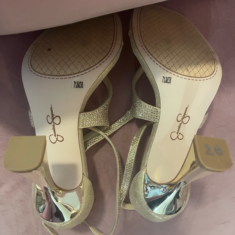 Size 7.5 strappy gold Jessica Simpson heels. Only worn in house.